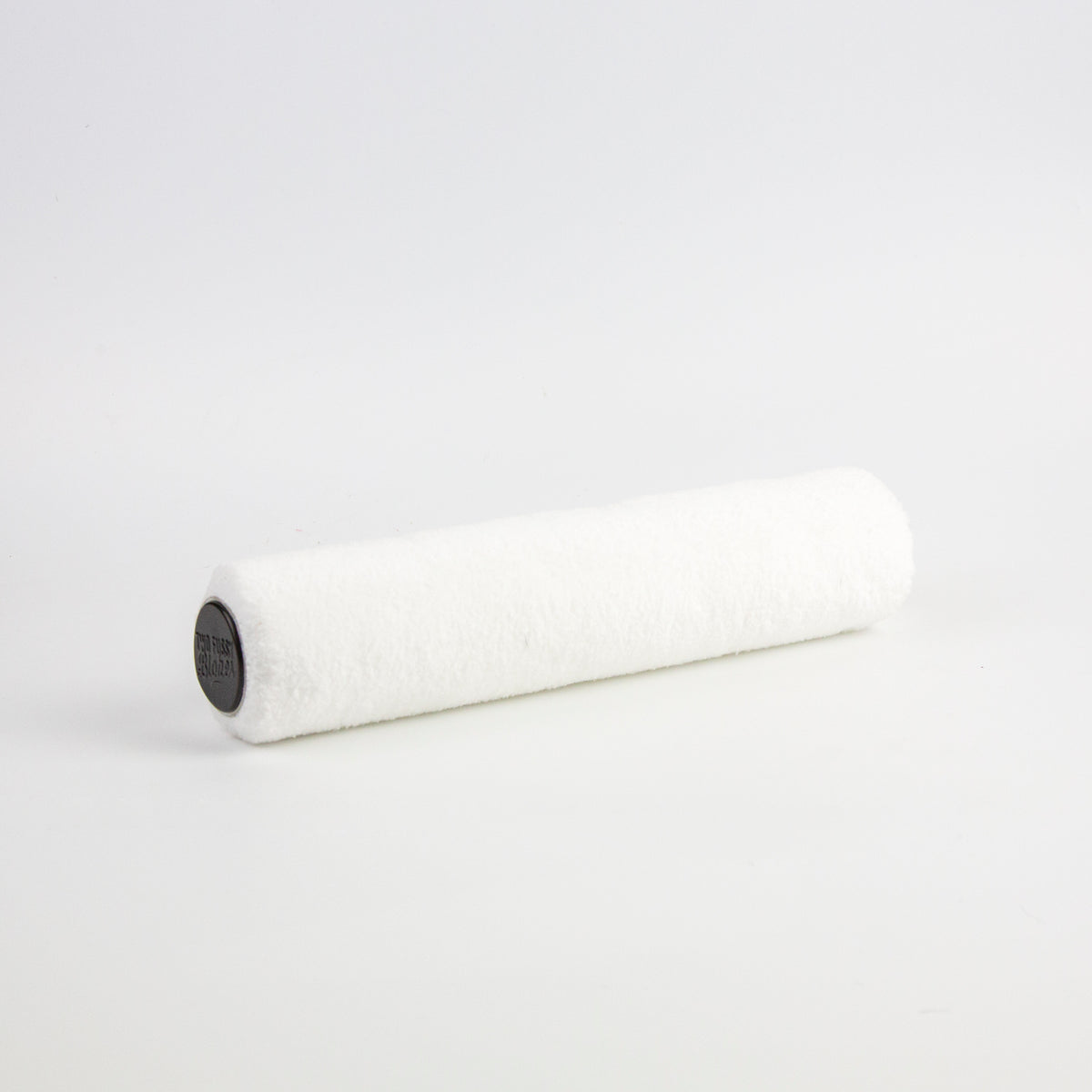 A white textured paint roller with a black plastic core, shown on a seamless white background.