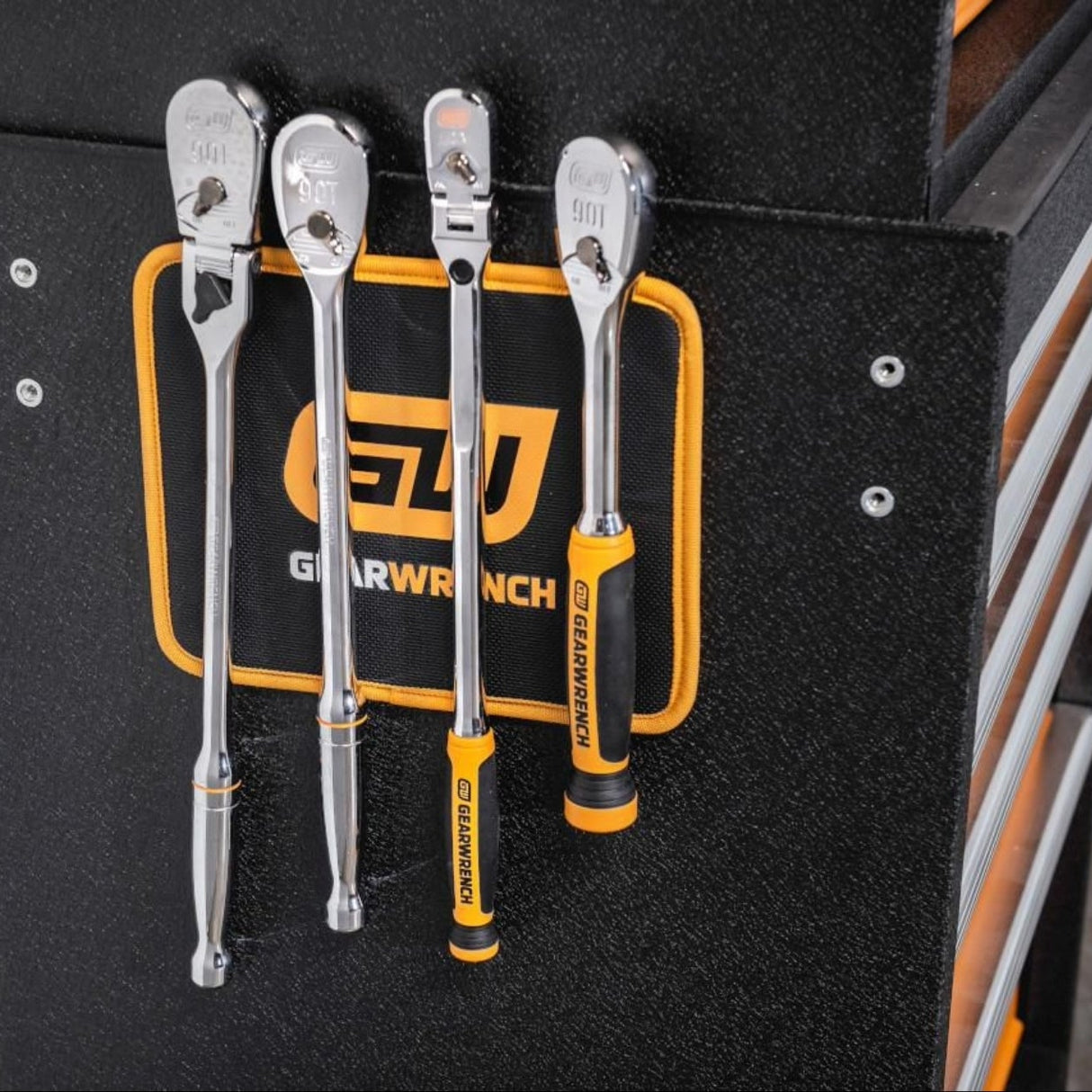 Set of GearWrench tools on a black tool organizer with visible brand logo.