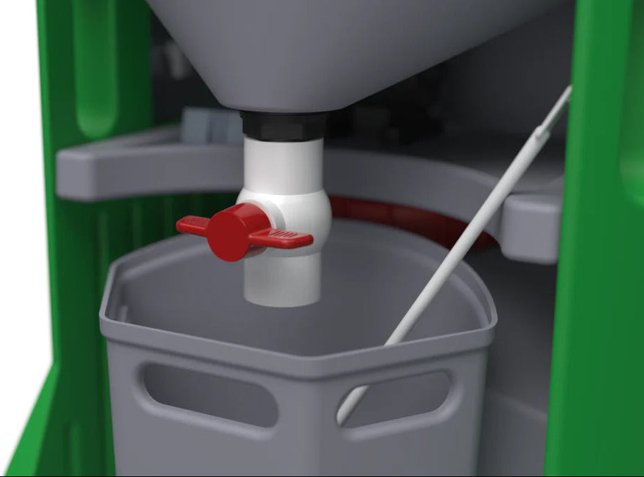 Close-up of a green and gray machine with a red valve on a white background