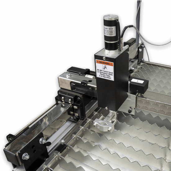 Industrial laser marking machine with a black and silver Z-axis gantry system, featuring a warning label and a metallic zig-zag bed, shown against a white background.