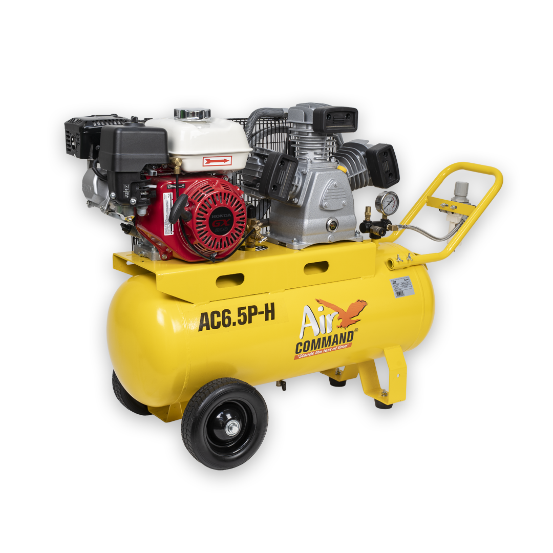 Yellow air compressor with engine on a white background