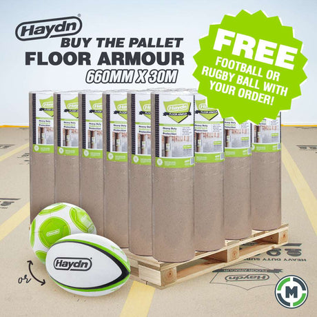 A pallet load of Haydn Heavy Duty Pallet Floor Armour 660mm x 30m rolls, shown on a wooden pallet with two Haydn rugby balls in the foreground. A green promotional badge on the right says 'FREE FOOTBALL OR RUGBY BALL WITH YOUR ORDER!'.