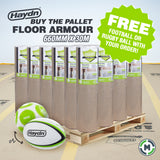 A pallet load of Haydn Heavy Duty Pallet Floor Armour 660mm x 30m rolls, shown on a wooden pallet with two Haydn rugby balls in the foreground. A green promotional badge on the right says 'FREE FOOTBALL OR RUGBY BALL WITH YOUR ORDER!'.