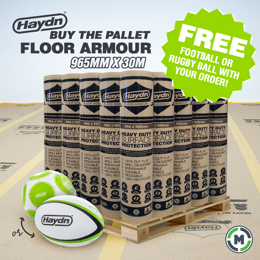 Haydn Heavy Duty Floor Armour rolls stacked on a wooden pallet with two green and white Haydn rugby balls in the foreground, plus promotional text and a green badge offering a free football or rugby ball with your order.