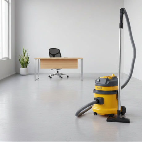 Yellow and gray vacuum cleaner on a white background
