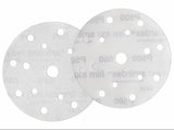 Two sanding discs with multiple holes on a white background