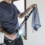 Person holding a Ninja cleaning tool with a towel