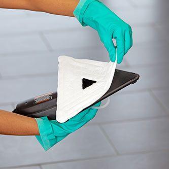 Person cleaning a glass surface 