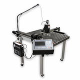 A large industrial CNC milling machine with a diamond-plate patterned work table, a vertical arm, a digital control panel, and an external power supply on a white background.