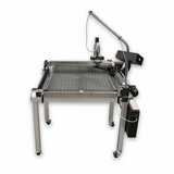 A large industrial laser marking machine with a silver aluminum frame, black control components, and a flexible black arm, shown on a plain white background.