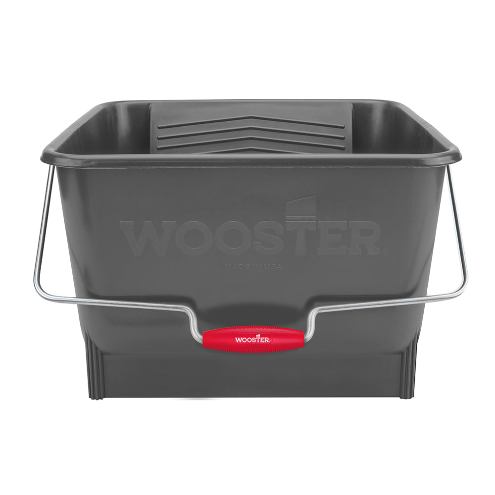 A dark gray plastic bucket with a silver metal handle and a red Wooster brand grip, shown on a plain white background.