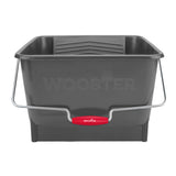 A dark gray plastic bucket with a silver metal handle and a red Wooster brand grip, shown on a plain white background.